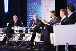 Main stage panel discussion: Technology. Shown (from left) are: Newmark Grubb Knight Frank executive managing director Geoff Kasselman; CoStar CEO Andrew Florance; Hightower CEO (and former broker) Brandon Weber; and Real Capital Markets chairman Geoff Woodward