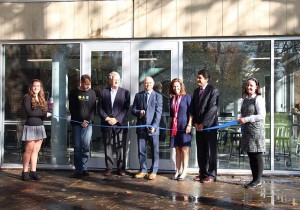 Shown (from left) are: Allendale Columbia School eighth grader Liz Cotter, Andrew Phelps of the RIT Magic Center, Rick Garrett of the Garrett Company, Allendale Columbia Head of Schools Mick Gee, assistant head for external affairs and campaign director Karyn Vella, executive vice president of the Pike Co. Mauricio Riveros, and Head of Middle School and science teacher Tina Duver cut the ribbon officially opening the new Design and Innovation Lab at Allendale Columbia School.