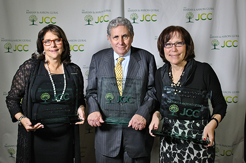 Shown (from left) are: Jane Gural Senders, Jeffrey Gural and Barbara Gural with awards recognizing their family’s role in establishing and growing what is now known as The Marion and Aaron Gural JCC. Photo credit: Bob Giglione.