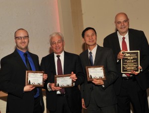 Shown (from left) are: Robert Dorsky, Crystal; Al Pennisi, president of Queens Chamber of Commerce; Thomas Chen, Crystal CEO; and Bob Friedrich, president of Glen Oaks Village co-op board.