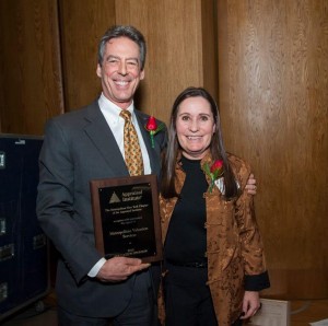 Shown is Schleider receiving an award in appreciation of his company serving as education sponsor for the Metro New York Chapter of the Appraisal Institute from then chapter president Theresa Nygard, KTR Real Estate Advisors.