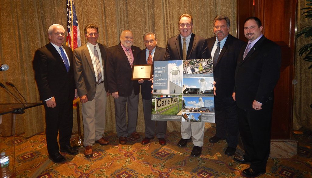 Shown (from left) are: Dennis Kelleher, P.E., president of H2M Water; Jim Passariello, assistant superintendent, Carle Place Water District; Peter Meade, secretary, Carle Place Water District; Lawrence Zaino, Jr., Treasurer, Carle Place Water District; Timothy Stellato, chairman, Carle Place Water District; Timothy Doyle, superintendent, Carle Place Water District; and Anthony M. Trombino, Senior Project Engineer – Water Resources, H2M architects + engineers.