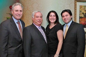 Shown (from left) are the partners at Mayer CPAs: Mark Ackerman, Robert Mayer, Marianna Mooney, and Stuart Mayer.