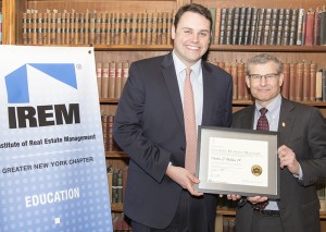 Shown (from left) are: Charles Slicklen, IV, and IREM president Paul Gottsegen. Photo credit: Van Stolatis.