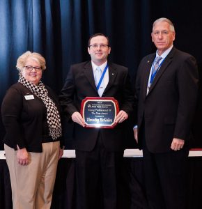 McGuire receiving the Young Professional of the Year Award.