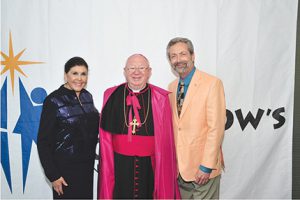 Shown (from left) are: Marie Zere, president and CEO, Zere Real Estate Services; Bishop William Francis Murphy, Roman Catholic Diocese of Rockville Centre; and Ken Greenberg, Patient Innovations.