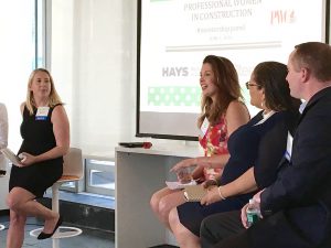 Shown (from left) are: Gemma Beasley, Hays Recruiting; Olivia Rousso (talking), Gilbane Building Co.; Liz Archer, Dewberry; and Adam Schaffer, Bloomberg.