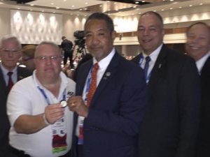 Shown is Kondrup presenting  Microsoft Global Security (represented by Mike Howard, CSO) with an ASIS LI Challenge Coin in recognition of their financial support of the Matt Simeone P3 Award.