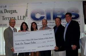 CIBS check presentation in 2014 for Hofstra University scholarship honoring the late general counsel Larry Feldman.