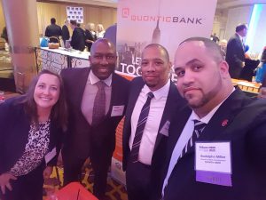 Shown (from left) are Quontic Bank’s: Aimee O’Connor, assistant; Anthony West, loan officer; Derrick Moore, loan officer; and Miller. 