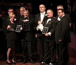 Halstead members accepting the "Award of Excellence."