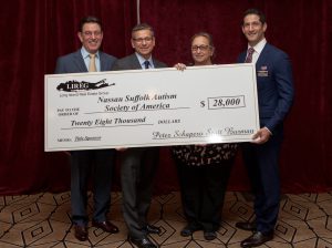 Shown (from left) are: Richard Herzbach, LIREG charity committee chair; Peter Schapero, LIREG co-president; Suzanne Reek, executive director of NSASA, and Scott Burman, LIREG co-president.